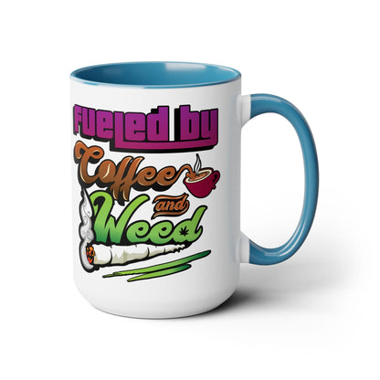 The Fueled by Coffee and Weed 15oz Coffee Mug is a ceramic mug with a blue handle and interior, featuring playful graphics of a coffee cup and joint plus the slogan "Fueled by Coffee and Weed.