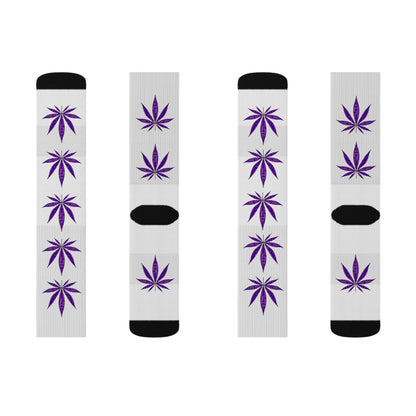 Four white crew socks with black heels and toes, each decorated with purple cannabis leaf patterns. The Purple Haze Weed Socks bring bold, standout style to your collection.