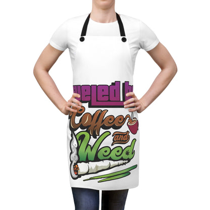 A person wears the "Fueled by Coffee and Weed Apron," which features colorful graphics of a coffee cup and a rolled joint.