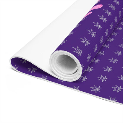 A rolled-up Make It Happen Cannabis, Bong, & Lighter foam purple yoga mat 