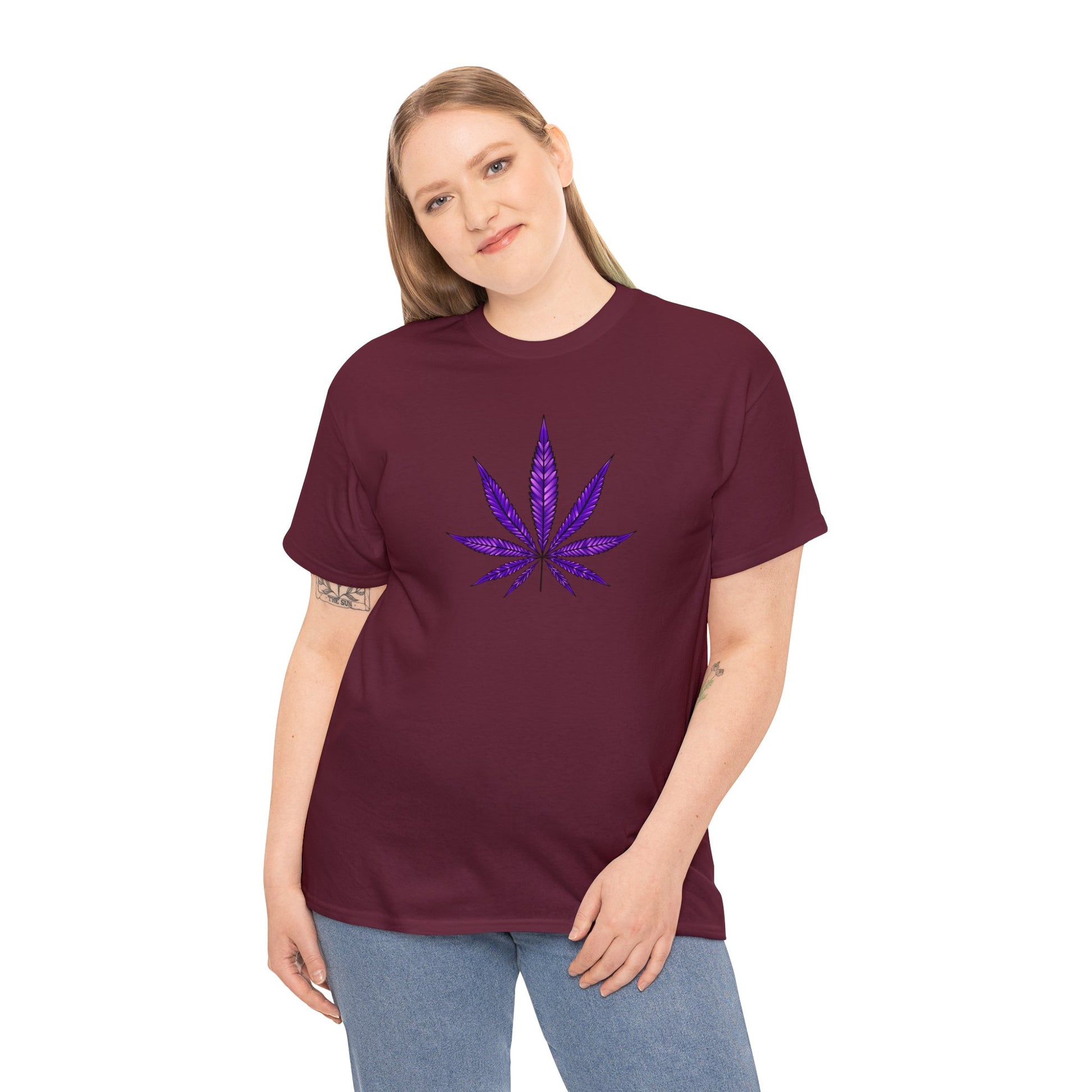 A woman wearing a Purple Cannabis Leaf Tee stands facing the camera.