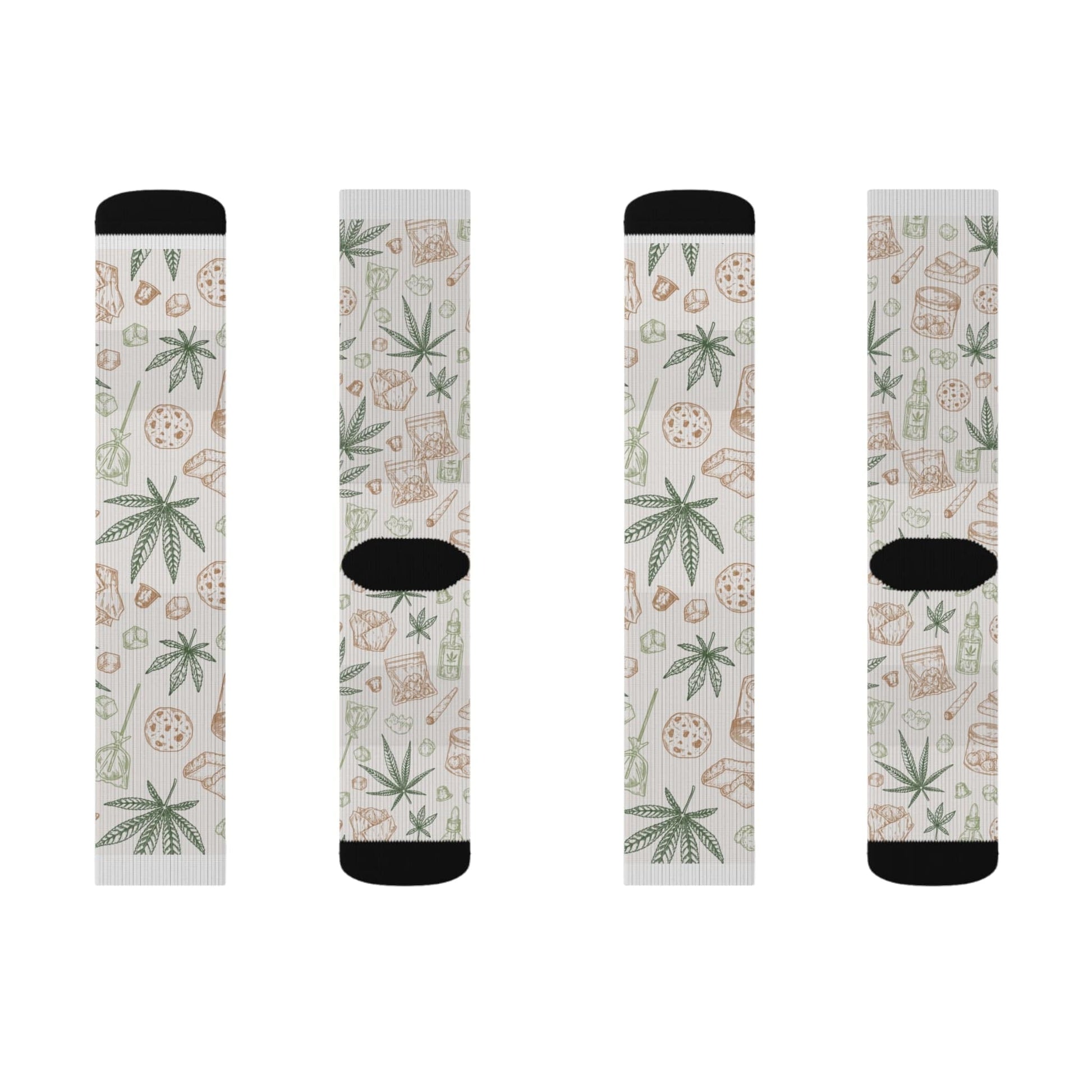 Retro Weed Socks: four white socks with black accents, decorated with green cannabis leaves and brown snack foods in a repeating pattern—an ideal 420 gift for any cannabis enthusiast.