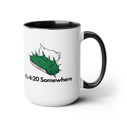 The It's 420 Somewhere 15oz Coffee Mug is a chic white ceramic cup featuring a black handle 