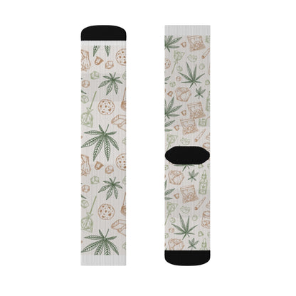 Retro Weed Socks in white feature green cannabis leaves, brown pizza slices, and burger designs, plus black toe and heel accents—making them a fun and quirky 420 gift.