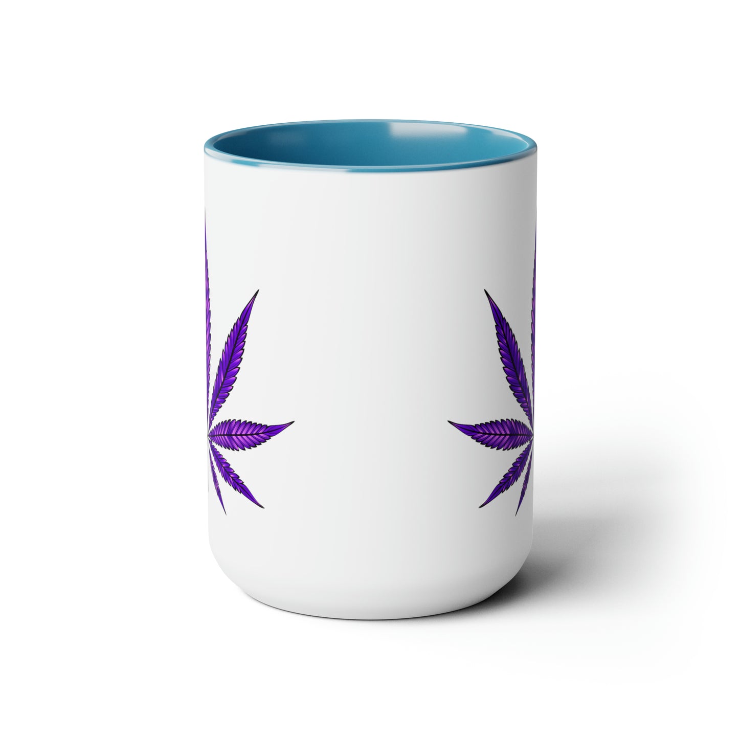Purple Haze Marijuana Coffee Mug with blue interior and two marijuana leaf designs, isolated on a white background.