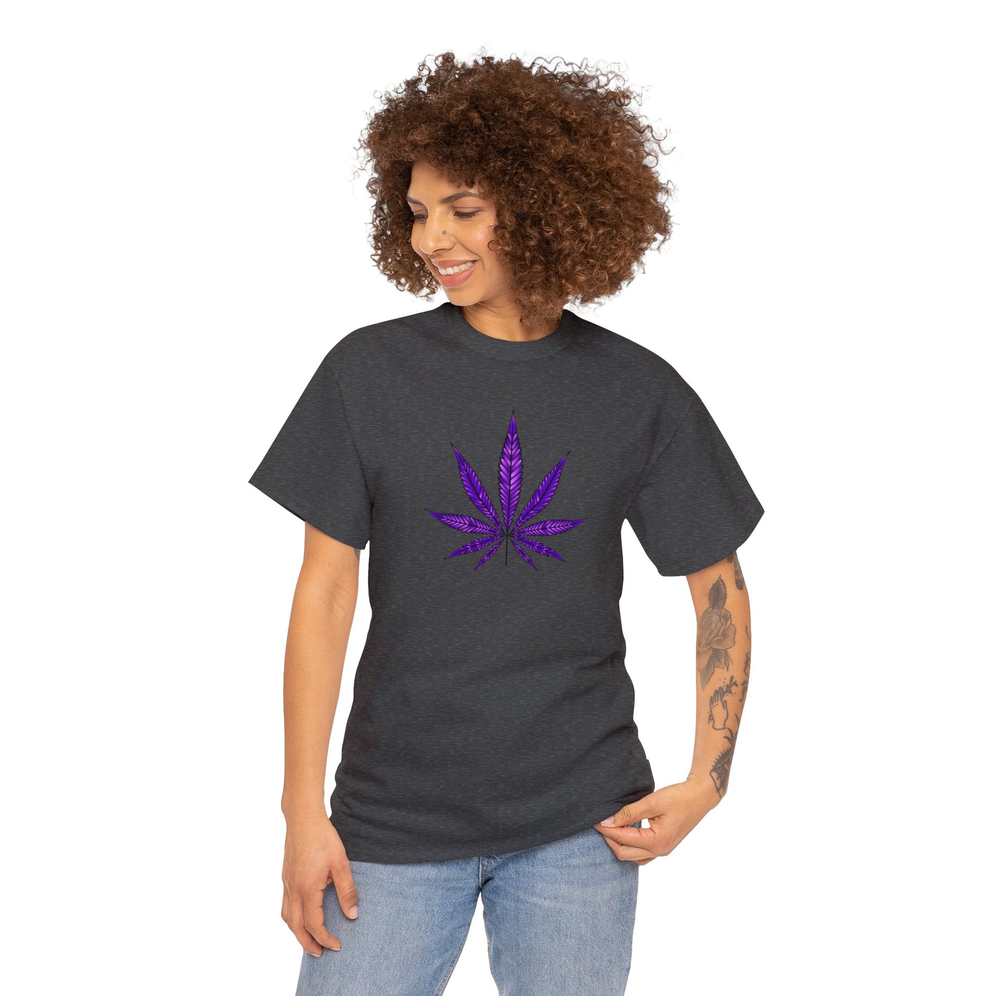 A person wearing a dark gray Purple Cannabis Leaf Tee with a vibrant purple cannabis leaf design on the front.