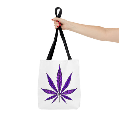 A hand holding a Purple Haze Marijuana Tote Bag, featuring a durable and spacious white design with black straps and a purple cannabis leaf printed on it.