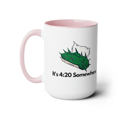 This "It's 420 Somewhere" 15oz Coffee Mug features a vibrant pink handle and interior