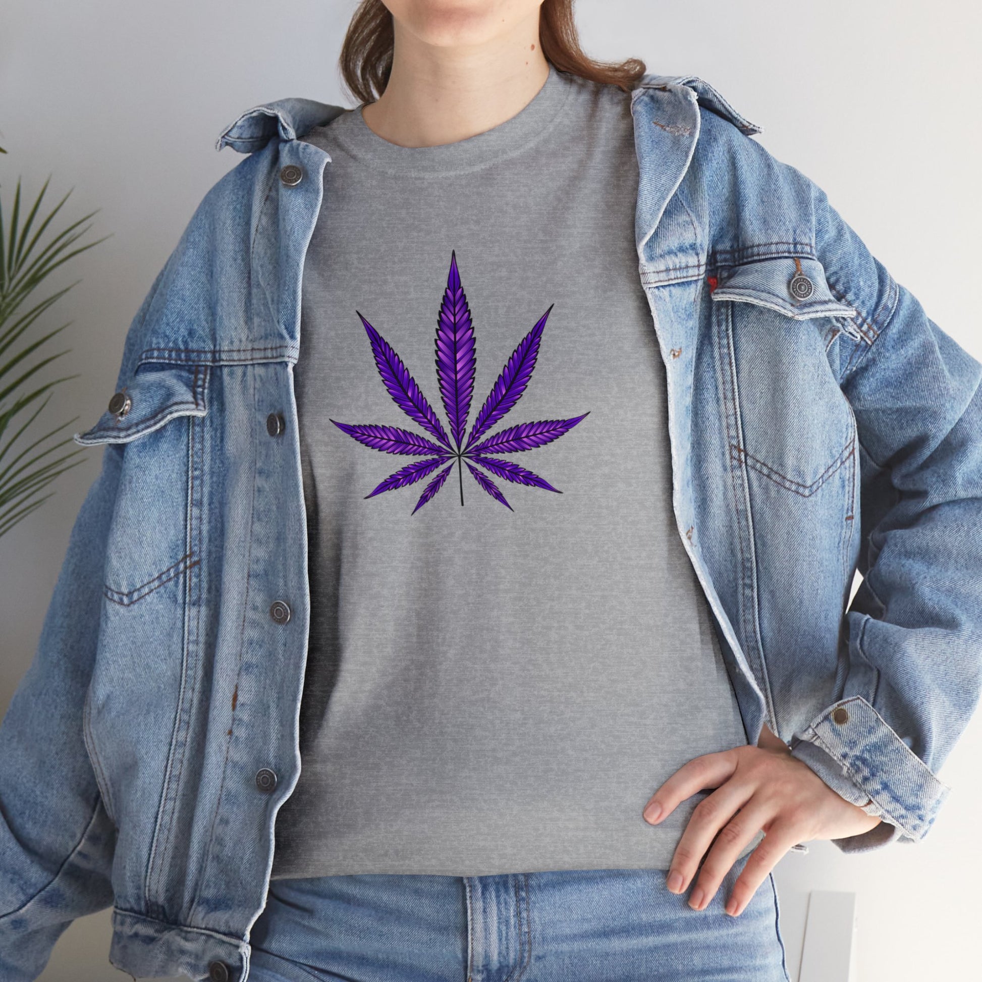 Sentence with Product Name: A person wearing a denim jacket over a vibrant color Purple Cannabis Leaf Tee, embracing marijuana culture.