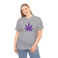 A woman wearing a gray Purple Cannabis Leaf Tee with a vibrant purple cannabis leaf design on the front.