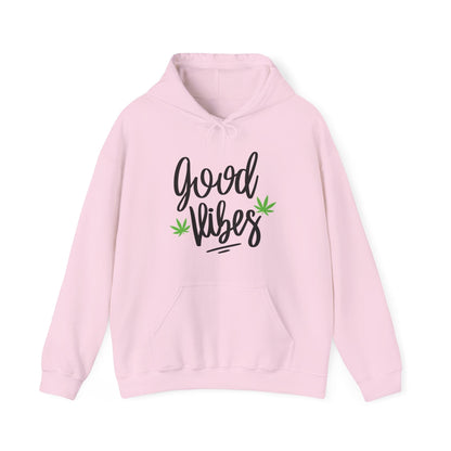The Good Vibes Marijuana Leaf Hoodie features a light pink color, bold black text, two cannabis leaf accents, a cozy essential style, front pocket, and drawstring hood.
