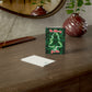 Be Merry Be Lit cards laying on window table top showing front and back design.