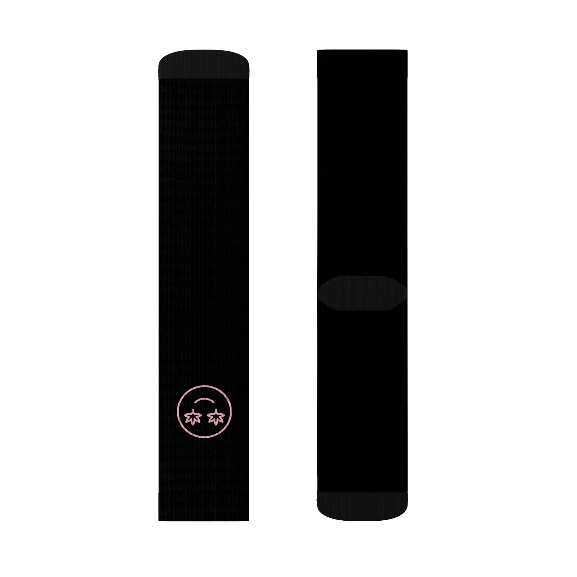 Two black crew-length High Stepper Weed Socks are shown side by side; one sock features a small, pink minimalist smiley face with star eyes near the ankle, combining style and comfort.