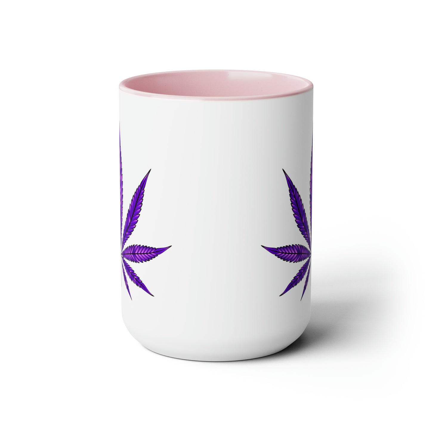 Purple Haze Marijuana Coffee Mug with pink interior and two Purple Haze marijuana leaf designs, isolated on a white background.