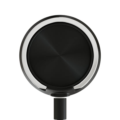 Close-up of the Make It Happen Cannabis Magnetic Induction Charger, a circular black and silver device 