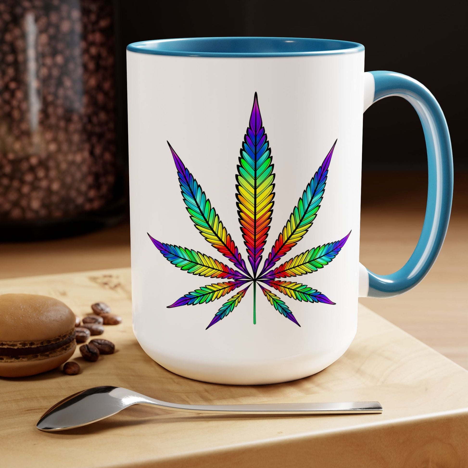 A Vibrant Rainbow Cannabis Mug, featuring a colorful marijuana leaf design and holding 15oz