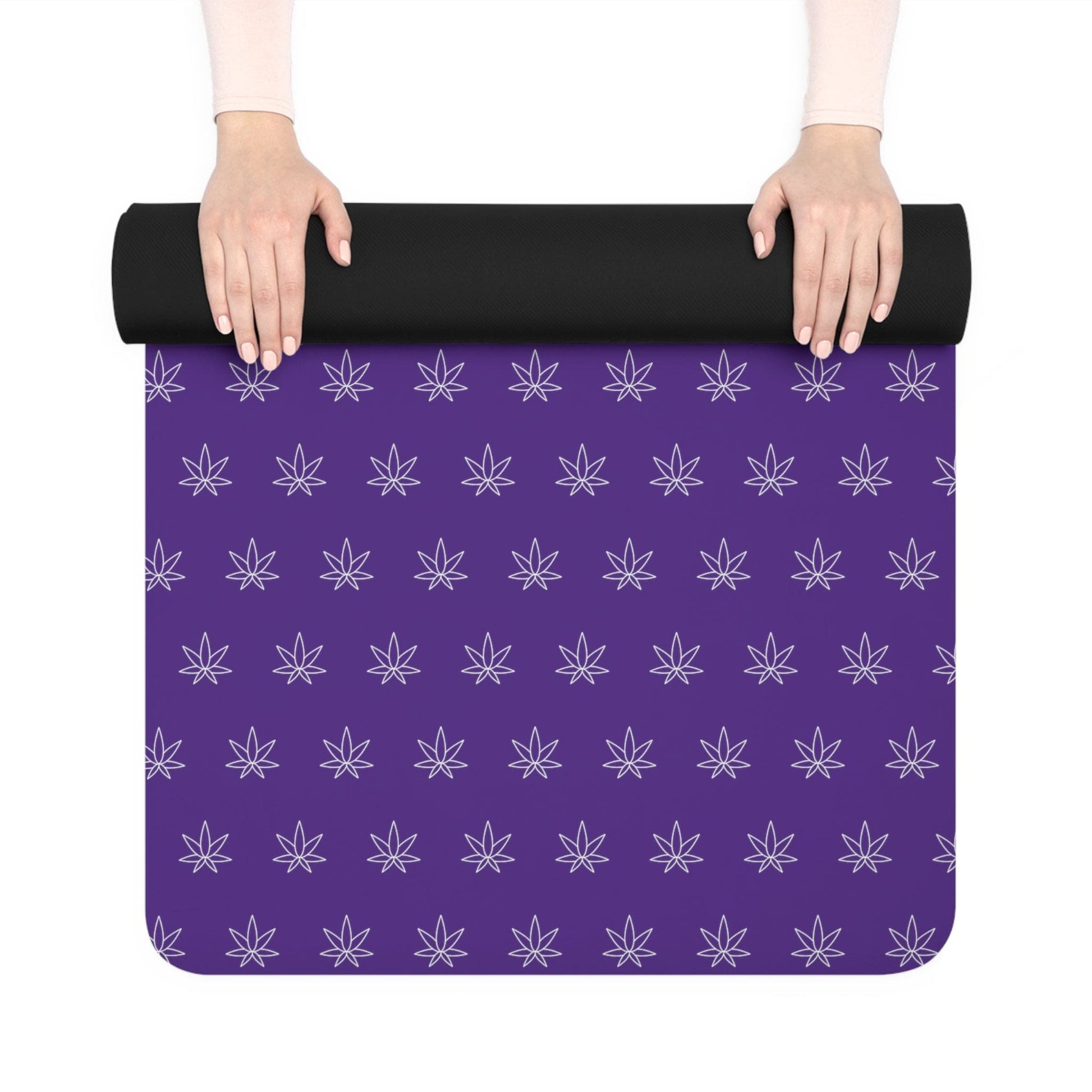 Hands unrolling the Make It Happen Cannabis Rubber Yoga Mat