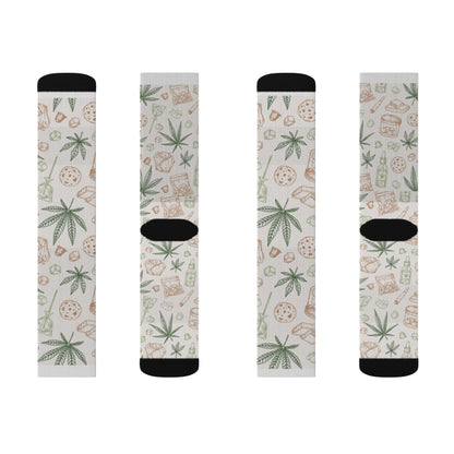 Retro Weed Socks feature four pairs with black toes and cuffs, each decorated in quirky cannabis style—pizza slices, weed leaves, and drink cartons on a light background. A perfect 420 gift for fans of fun socks!.