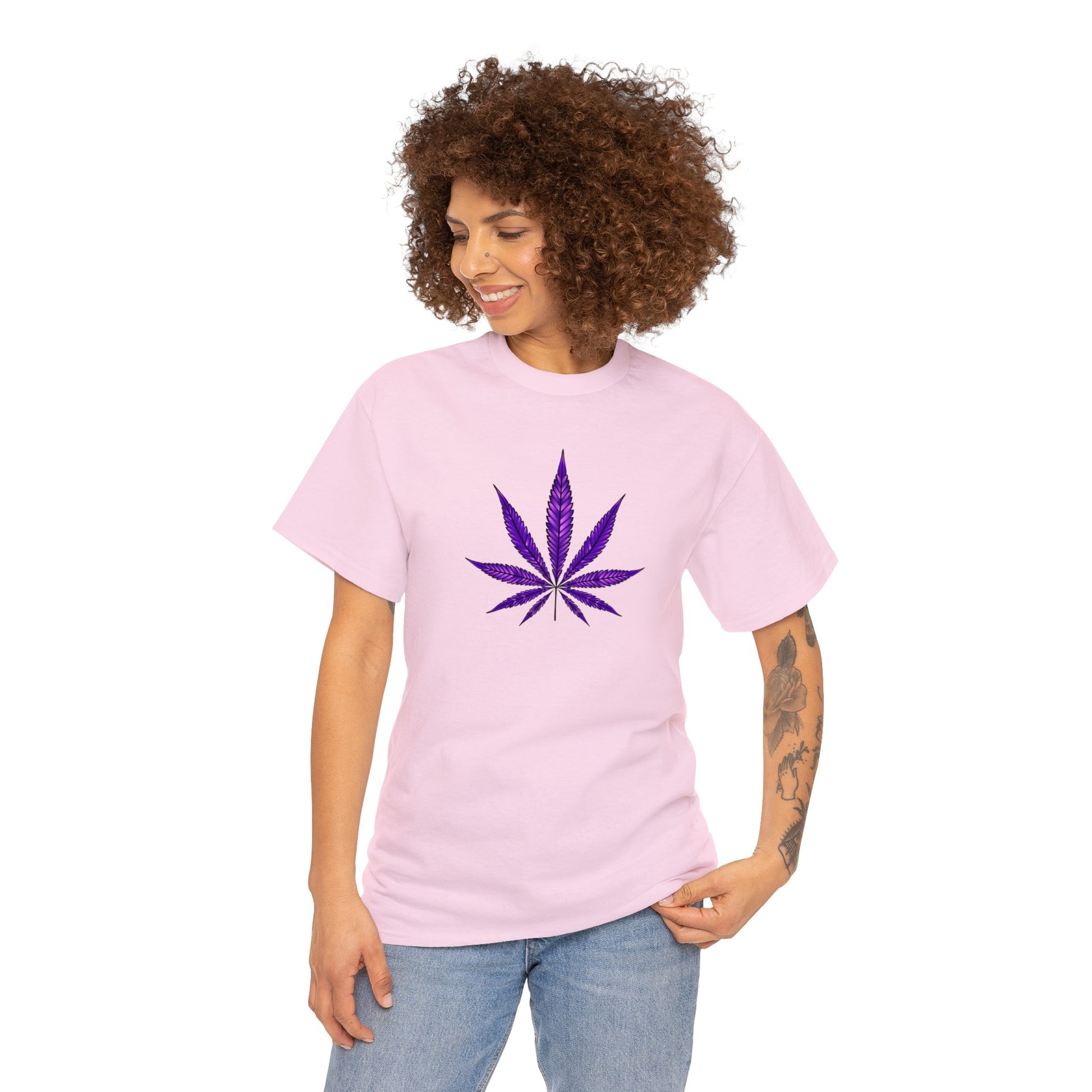 A woman with curly hair wearing a vibrant Purple Cannabis Leaf Tee.