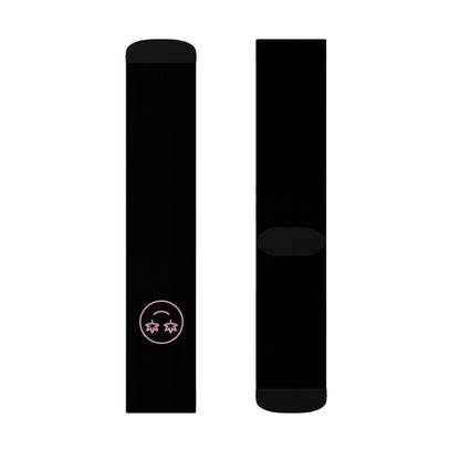 Two black High Stepper Weed Socks are shown; one features a small pink smiley face with star-shaped eyes near the top, while the other sock is plain.