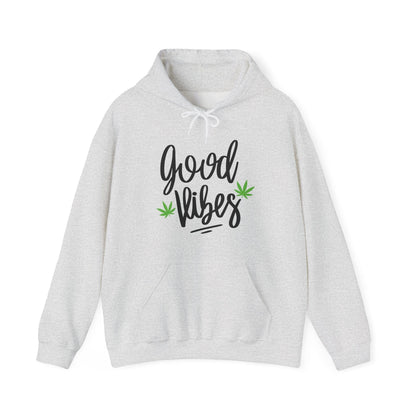 The Good Vibes Marijuana Leaf Hoodie is ultra-comfy, light gray, featuring "good vibes" in black script and two small green marijuana leaf graphics on the front.
