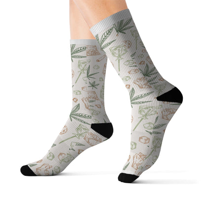Person wearing Retro Weed Socks—light crew socks with green and brown botanical patterns, black toes, heels, and cuffs. A fun 420 gift for any cannabis enthusiast.