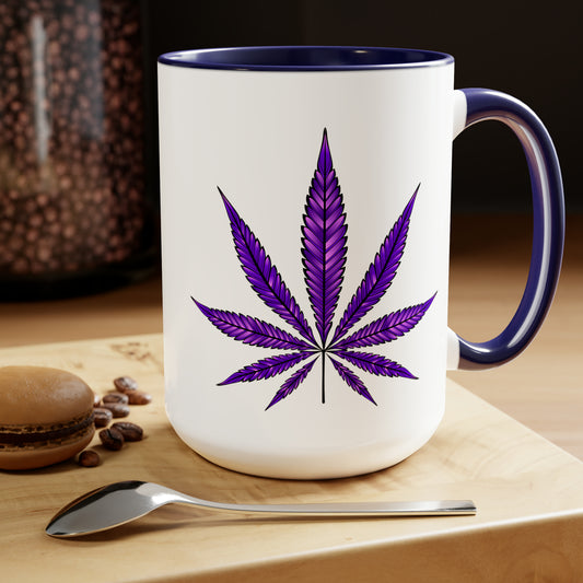 Purple Haze Marijuana Coffee Mug on a wooden table featuring a Purple Haze Marijuana leaf design, accompanied by coffee beans, a spoon, and a macaron.