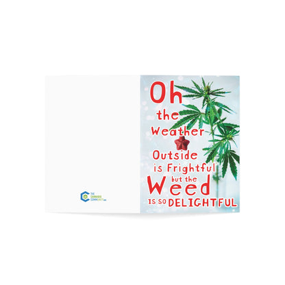 Greeting card crafted from sustainable paper featuring a cannabis leaf and text saying "Oh the weather outside is frightful but the Weed is So Delightful.