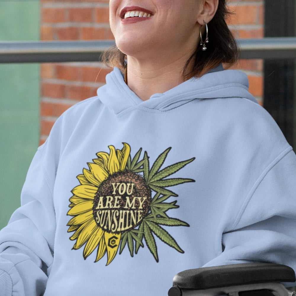 Woman wearing a You Are My Sunshine Hoodie