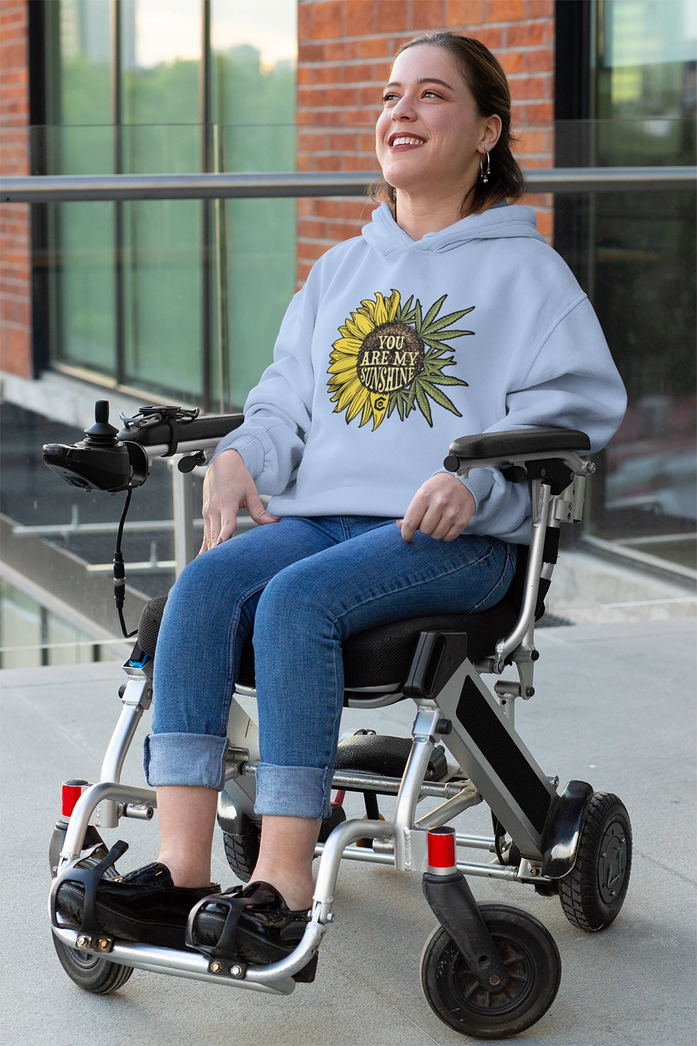 Disabled Woman in wheel chair is wearing a You Are My Sunshine Light Blue Hoodie