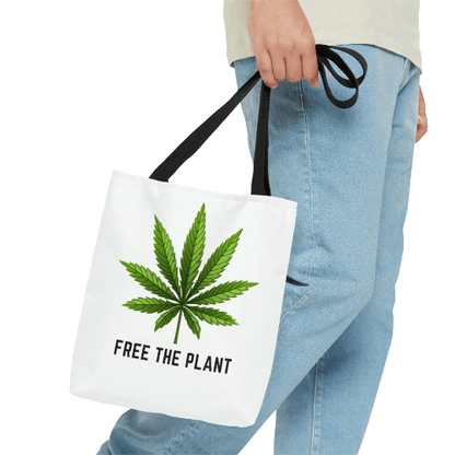 Someone is holding the Free The Plant Marijuana Tote Bag, crafted from premium material