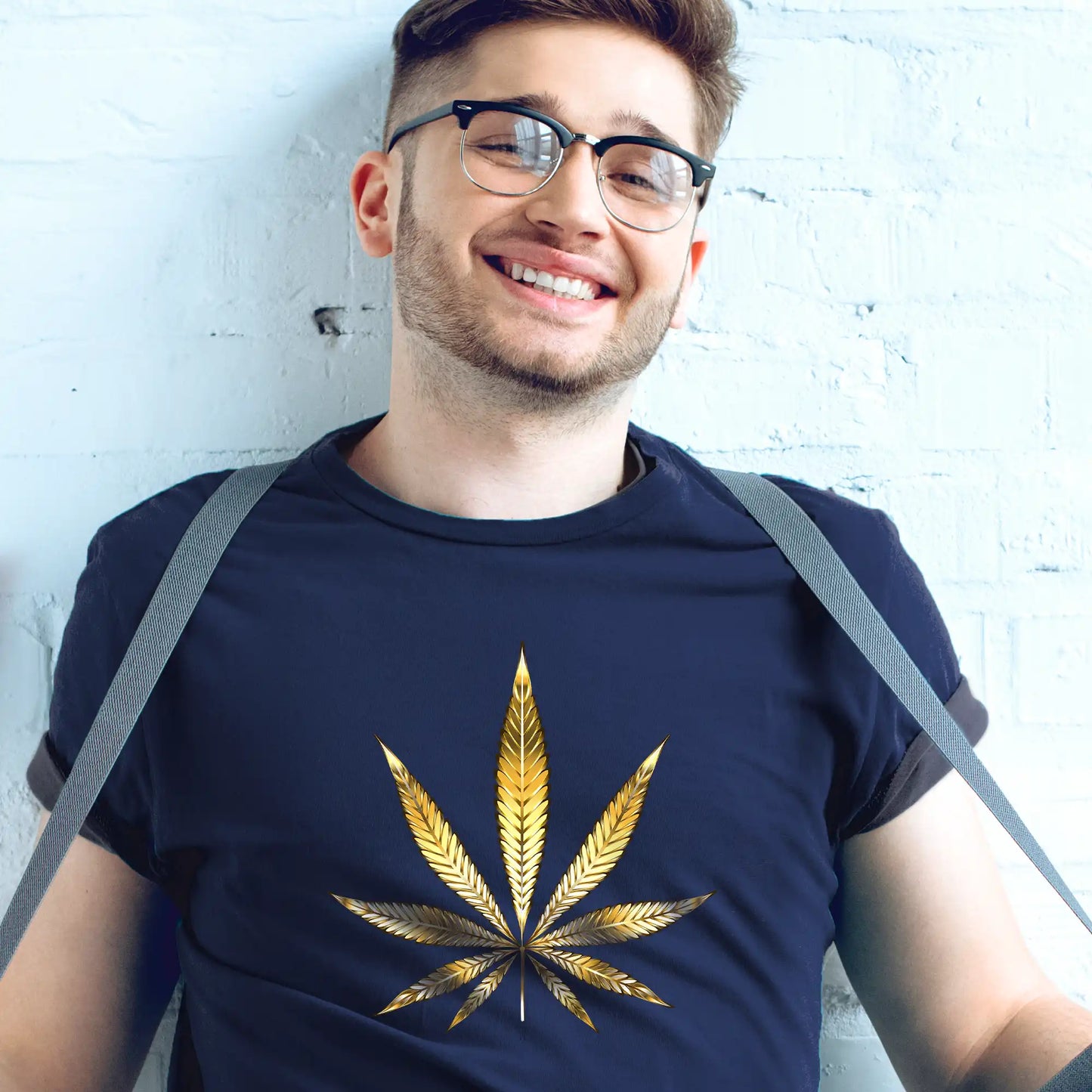 a young man wearing a Gold Marijuana Leaf Tee.