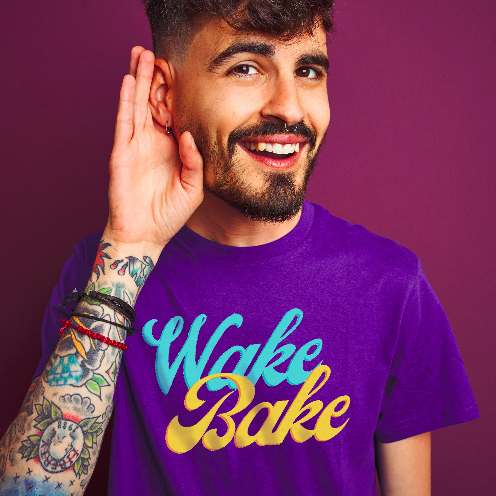 a young man with tattoos wearing a purple wake and bake shirt