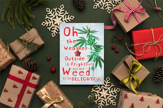 A holiday-themed image displaying a customized Weed is So Delightful greeting card with the text "oh the weather outside is frightful but the weed is so delightful," surrounded by various gift boxes and snowflake decorations.
