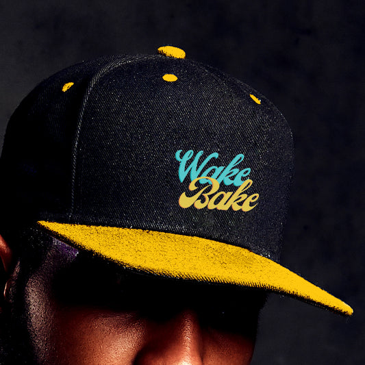 Close up of a young man wearing the Wake and bake cannabis Hat in black and gold