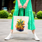 A woman in a green polka dot dress is holding a Warm Cannabis Paradise Weed Tote Bag
