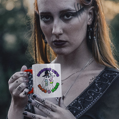 Wiccan Witch in the woods drinking from her Bong Boos and Buds coffee mug closeup