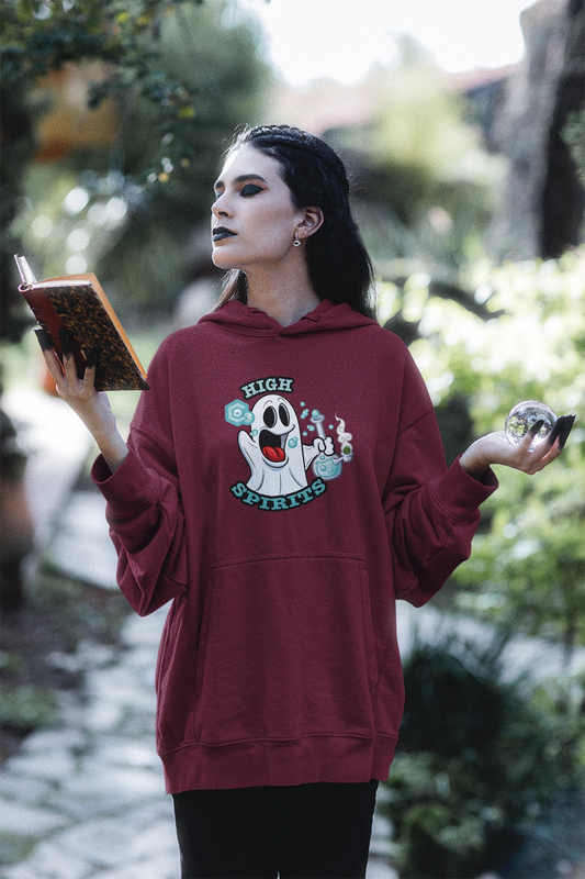 witch in the woods casting a spell wearing a maroon High Spirits Halloween Hoodie