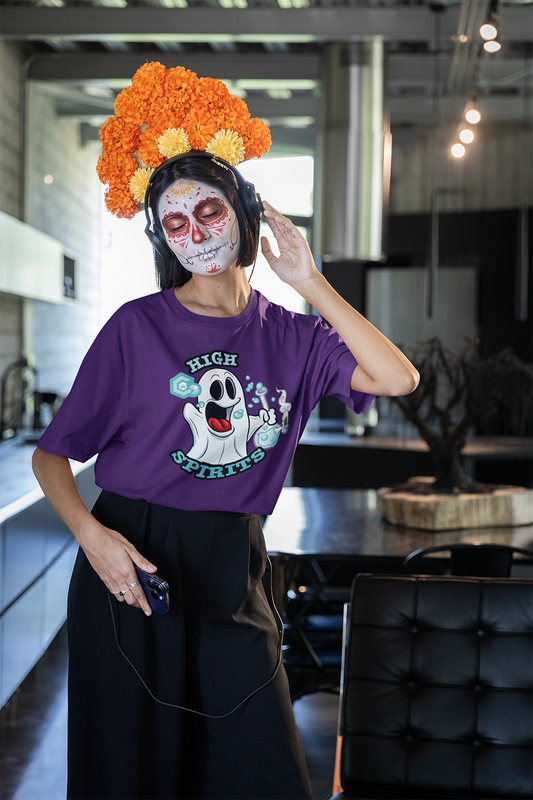 woman wearing a purple high spirits weed shirt with a day of the dead face mask while listing to music