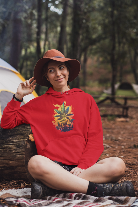Woman Camping and sitting wearing a red Marijuana Leaf Paradise hoodie