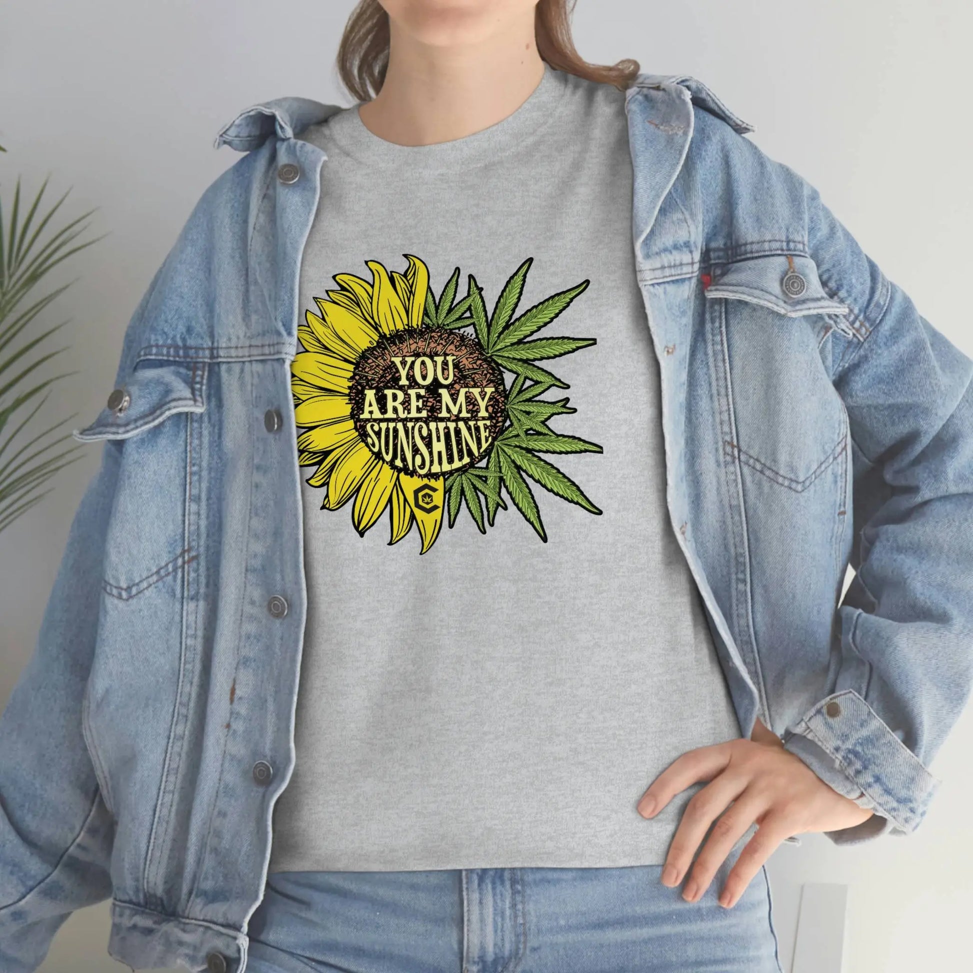 a woman wearing a You Are My Sunshine Weed T-Shirt.