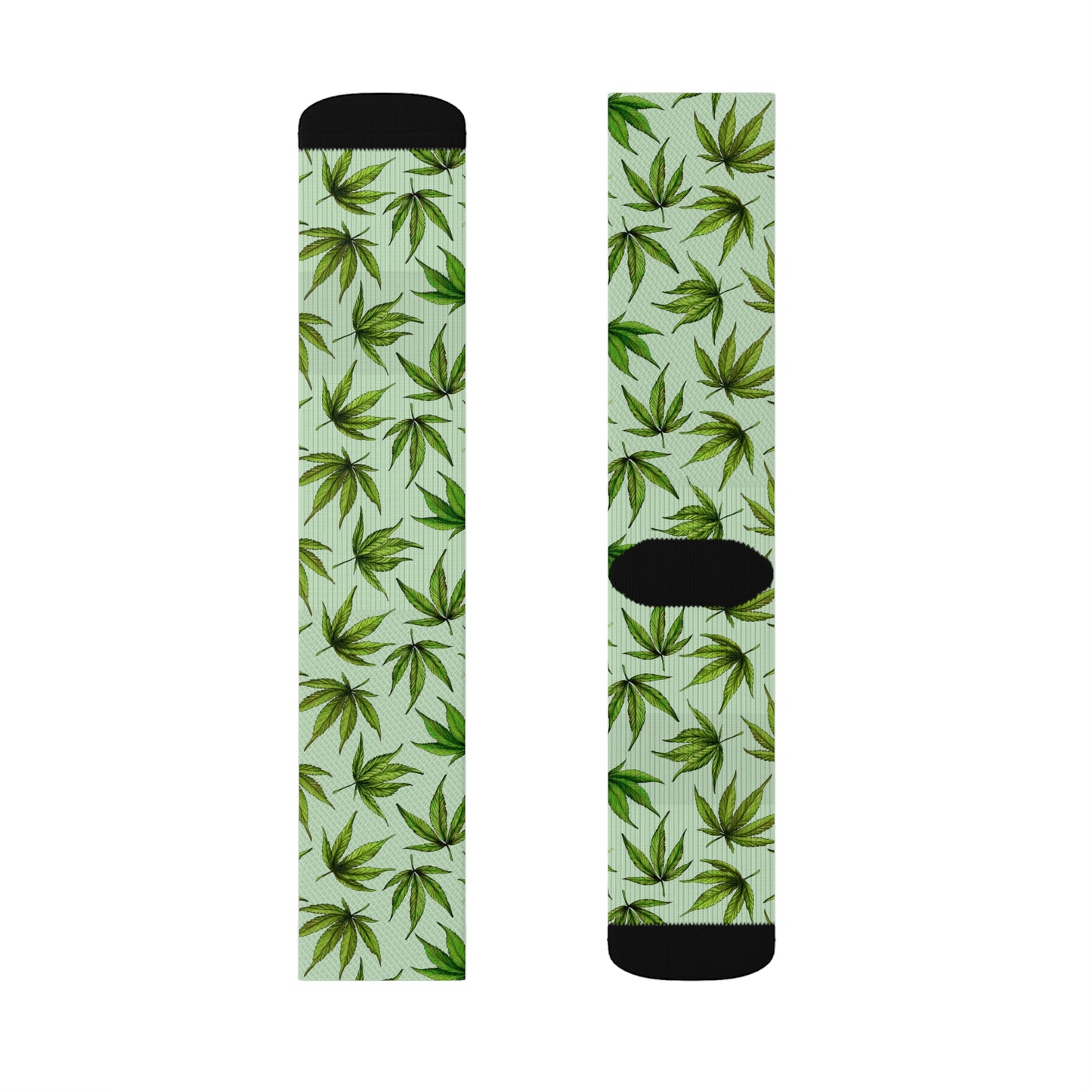 a single pair of green and black dope socks with cannabis leaves in green with a black heel