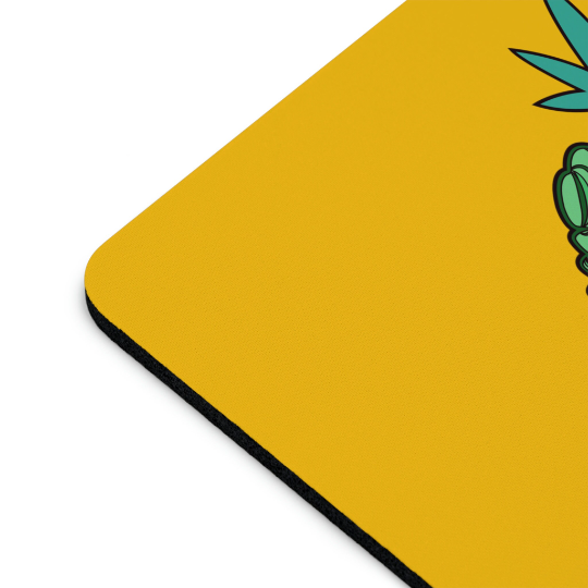 Let's Get Baked Marijuana Yellow mouse pad with a partial view of a green tropical leaf design on the upper left, featuring a smooth black border.