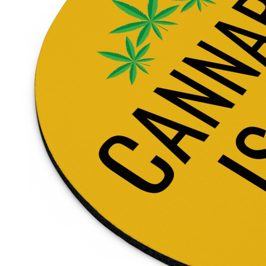 Round yellow non-slip Cannabis is Life mouse pad with bold black letters spelling "cannabis" and green cannabis leaf design on a white background.