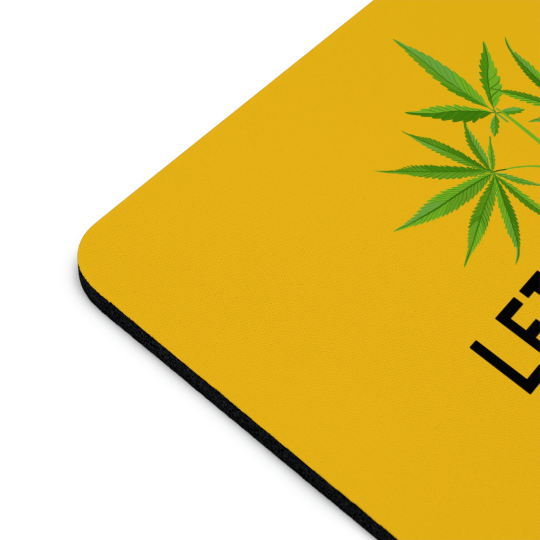 Let My People Grow Yellow Mousepad with a cannabis leaf design, black trim around the edges, and "Let My People Grow" printed at the bottom corner.