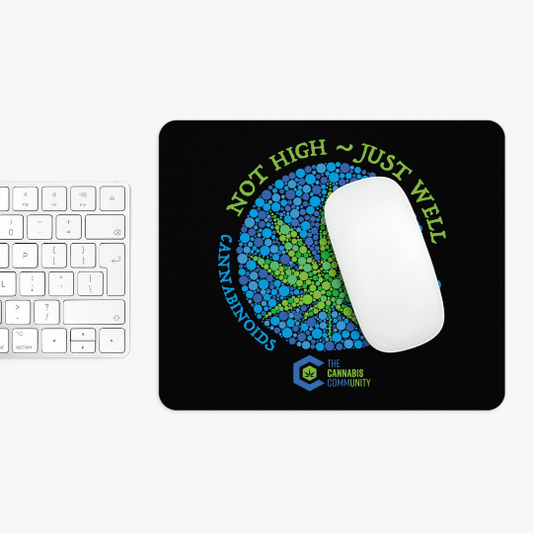 A non-slip Not High, Just Well Black Mouse Pad featuring a colorful cannabis leaf design and the text "not high ~ just well cannabinoids" along with "the cannabis community" logo.