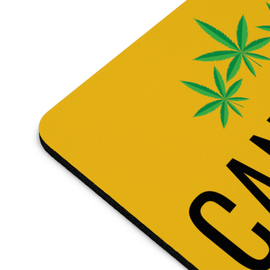 Cannabis is Life Yellow Mouse Pad with cannabis leaf design and the word "cbd" printed in large black letters, isolated on a white background.