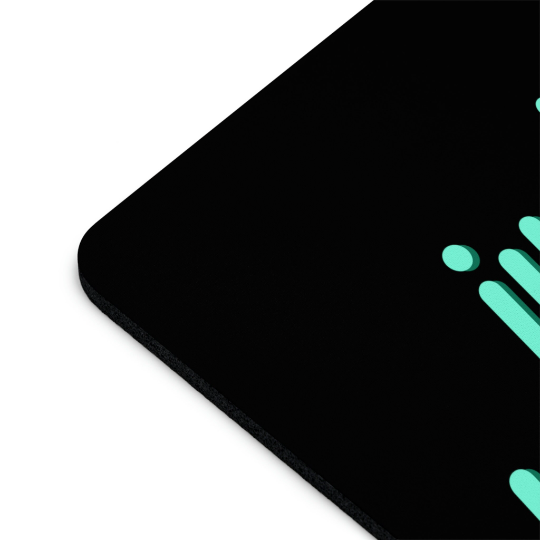 Close-up of a corner of a Just Breathe Cannabis black non-slip mouse pad with a turquoise abstract design, highlighting its textured surface and stitched edge.
