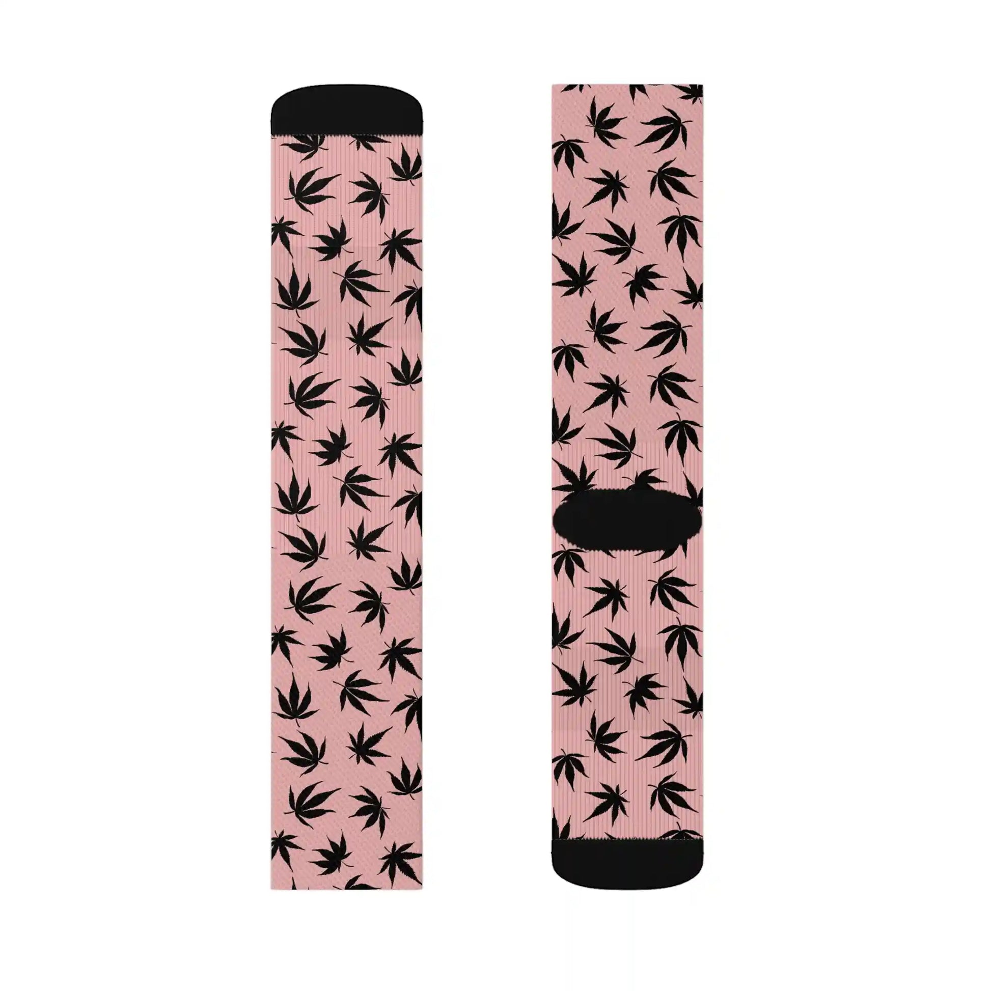 a pair of pink and black weed socks with cannabis leaves in black