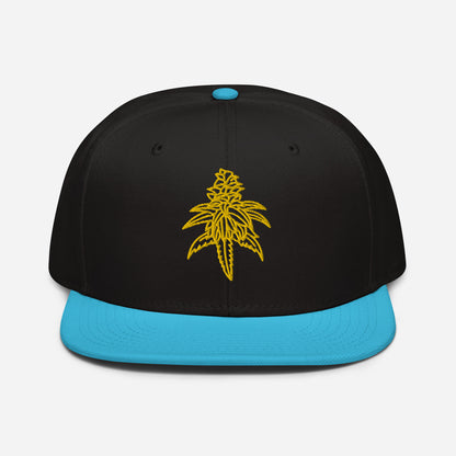 Golden Goat Cannabis Snapback Hat with a yellow stylized leaf embroidery on the front.